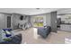Open concept living and dining area featuring modern decor, dining table and kitchen at 4548 Cepeda St, Orlando, FL 32811