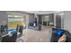 Open floor plan with modern living room, dining area, and slider to outdoor space at 4548 Cepeda St, Orlando, FL 32811