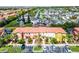 Scenic aerial view of the townhomes showcasing colorful facades, lush landscaping, and convenient parking at 4743 Vero Beach Pl, Kissimmee, FL 34746