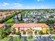 Scenic aerial view of the townhomes showcasing colorful facades, lush landscaping, and convenient parking at 4743 Vero Beach Pl, Kissimmee, FL 34746