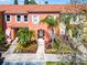 Charming townhouse featuring a red tile roof and well-maintained landscaping at 4743 Vero Beach Pl, Kissimmee, FL 34746