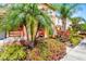 Townhouse featuring vibrant landscaping, walkway, and inviting curb appeal at 4743 Vero Beach Pl, Kissimmee, FL 34746