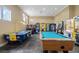 Community game room featuring a pool table, arcade games, and a vending machine at 4743 Vero Beach Pl, Kissimmee, FL 34746
