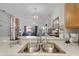 Close up of the kitchen stainless sink, white counter tops and light fixtures at 4743 Vero Beach Pl, Kissimmee, FL 34746