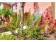 Close-up of a townhouse exterior showing tropical foliage and a charming facade at 4743 Vero Beach Pl, Kissimmee, FL 34746