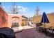 Private brick patio featuring outdoor seating, grill, and shaded lounge area at 4743 Vero Beach Pl, Kissimmee, FL 34746