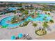 Aerial view of the community pool and water park with pools and sun loungers at 481 Ocean Course Ave, Davenport, FL 33896