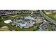 Extensive aerial view of a community featuring pools, houses and many parking spaces at 481 Ocean Course Ave, Davenport, FL 33896
