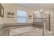 Bright bathroom features a modern soaking tub, glass shower, and neutral tile at 481 Ocean Course Ave, Davenport, FL 33896