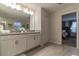 Bathroom with double sinks and view to main bedroom at 481 Ocean Course Ave, Davenport, FL 33896