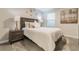 Cozy bedroom featuring stylish decor, soft carpet, and a comfortable bed with elegant bedside tables at 481 Ocean Course Ave, Davenport, FL 33896