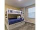 A lovely ' bedroom features a white bunk bed with gray carpeting at 481 Ocean Course Ave, Davenport, FL 33896