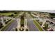 Community entrance to ChampionsGate with palm trees and manicured landscaping on a sunny day at 481 Ocean Course Ave, Davenport, FL 33896