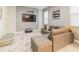Stylish living room featuring a comfortable sofa, modern TV, and chic decor at 481 Ocean Course Ave, Davenport, FL 33896