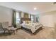 Relaxing main bedroom featuring plush carpet, a luxurious bed, and soothing green accents at 481 Ocean Course Ave, Davenport, FL 33896