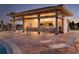 Outdoor kitchen by the pool featuring a bar and lounge chairs for entertaining at 481 Ocean Course Ave, Davenport, FL 33896