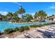 Community pool featuring a water slide and sun loungers with palm tree landscaping at 481 Ocean Course Ave, Davenport, FL 33896