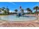 Gathering-friendly splash pad with water slides, a tipping bucket, and lounge seating at 481 Ocean Course Ave, Davenport, FL 33896