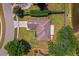 Aerial view of a home with a well-maintained yard, defined by a blue boundary line, with a pond in view at 4811 Doc Dr, St Cloud, FL 34771