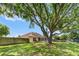 Spacious backyard features a lush lawn, mature trees, and a privacy fence, ideal for outdoor enjoyment at 4811 Doc Dr, St Cloud, FL 34771
