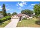 Charming single-story home with well-maintained landscaping, a front yard, and a two-car garage at 4811 Doc Dr, St Cloud, FL 34771