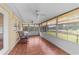 The bright sunroom offers tile floors, multiple windows, and two ceiling fans, perfect for relaxation at 4811 Doc Dr, St Cloud, FL 34771
