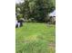 Expansive backyard with mature trees and lush green lawn at 4834 Ute St, Orlando, FL 32819