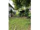 Outdoor area with grass and fence and lush greenery provides privacy at 4834 Ute St, Orlando, FL 32819