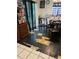Kitchen featuring a table and chairs, damaged flooring, and black and white patterned accents at 4834 Ute St, Orlando, FL 32819
