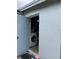Exterior access to laundry area with washing machine at 4834 Ute St, Orlando, FL 32819