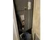 Utility closet housing a furnace, showing water bottles stored in the bottom and an old, tired appearance at 4834 Ute St, Orlando, FL 32819