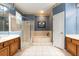 Bathroom features a tub, step in shower, double vanity, and neutral tile at 4911 Lazy Oaks Way, St Cloud, FL 34771