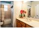 Neutral bathroom features a single vanity and shower-tub combination at 4911 Lazy Oaks Way, St Cloud, FL 34771