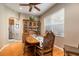 Traditional dining room with wood floors, cabinet, and windows providing natural light at 4911 Lazy Oaks Way, St Cloud, FL 34771