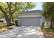 Spacious two-car garage with an extended driveway, providing ample parking at 4911 Lazy Oaks Way, St Cloud, FL 34771