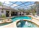 Resort-style pool featuring a spa, tropical island, and outdoor lounge, ideal for entertaining at 4911 Lazy Oaks Way, St Cloud, FL 34771