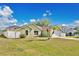 Charming one-story home with a well-manicured lawn, white fencing and a two-car garage at 50 Sawfish Ct, Kissimmee, FL 34759