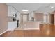 An open kitchen features white cabinets, granite countertops, and stainless steel appliances at 50 Sawfish Ct, Kissimmee, FL 34759