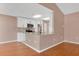 An open kitchen features white cabinets, granite countertops, and stainless steel appliances at 50 Sawfish Ct, Kissimmee, FL 34759