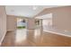 Bright living room with vaulted ceiling, hardwood floors, and sliding glass doors leading to the backyard at 50 Sawfish Ct, Kissimmee, FL 34759