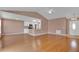 Open living space featuring hardwood floors connecting the living room, dining room and kitchen at 50 Sawfish Ct, Kissimmee, FL 34759