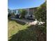 Exterior of home featuring siding, plants, and stone path, ideal for outdoor living at 50989 Highway 27 # 210, Davenport, FL 33897