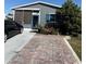 Charming home featuring vinyl siding, and a paved driveway and patio for outdoor gatherings at 50989 Highway 27 # 210, Davenport, FL 33897