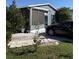 Charming home featuring vinyl siding, and a paved driveway and patio for outdoor gatherings at 50989 Highway 27 # 210, Davenport, FL 33897