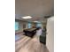 Spacious game room featuring two billiard tables, comfortable seating, and wood-style flooring at 50989 Highway 27 # 210, Davenport, FL 33897