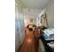 Inviting living room featuring hardwood floors, comfortable seating, and an abundance of natural light at 50989 Highway 27 # 210, Davenport, FL 33897