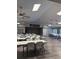 Community meeting room with tables, chairs, and ceiling fans, providing a versatile space for gatherings at 50989 Highway 27 # 210, Davenport, FL 33897