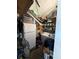 Organized storage room with shelving, refrigerator, and washing machine at 50989 Highway 27 # 210, Davenport, FL 33897