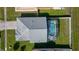 A bird's-eye view reveals a private screened-in pool, perfect for enjoying sunny days at 5275 Warrior Ln, Kissimmee, FL 34746