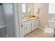 Bright bathroom featuring a double vanity, ample counter space, and updated fixtures at 5275 Warrior Ln, Kissimmee, FL 34746